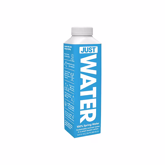 A blue rectangular carton labeled "JUST WATER" vertically in large white letters. At the top, it reads "100% Spring Water" and "Sustainably sourced water in a plant-based carton." The volume is 16.9 FL OZ (1.06 PT) 500 mL. The carton has a white screw cap and highlights eco-friendly messaging on the side, including icons and facts about the sustainability of the packaging and sourcing process.